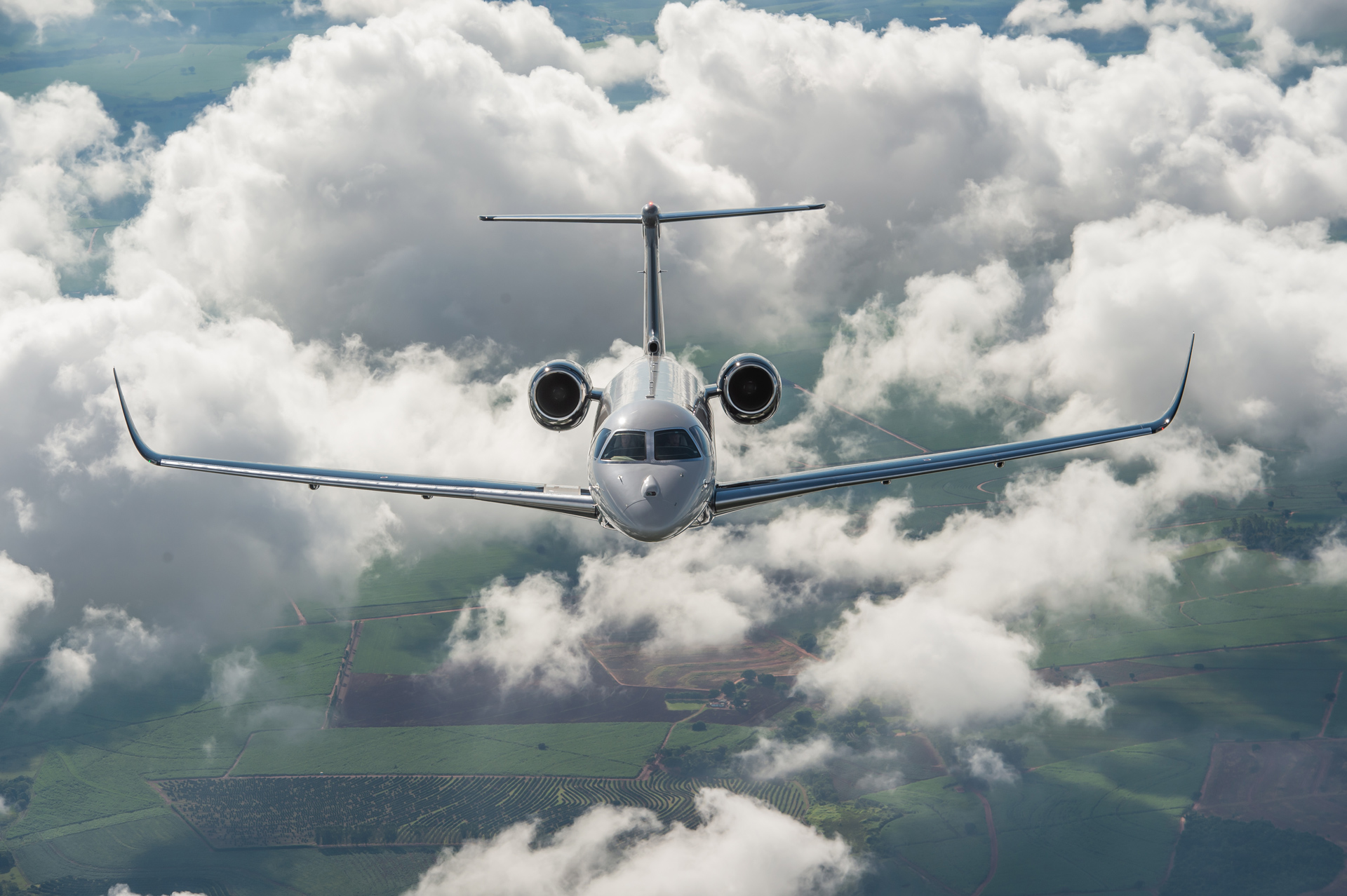 The Embraer Praetor 600 business jet flying through cloud.